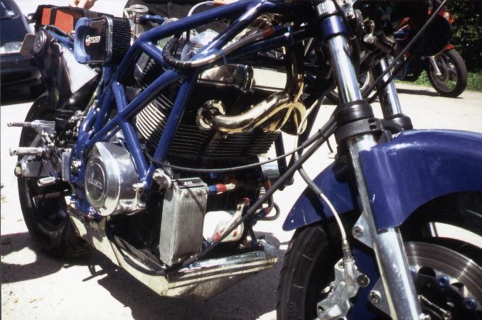 pipes lead upwards over the engine